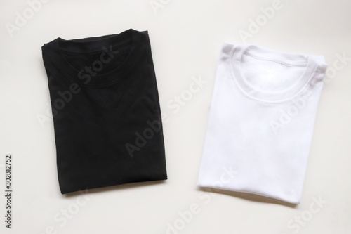 black , gray , white t-shirts with wood box and cactus. rustic background