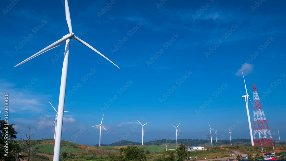 Fototapeta premium Wind turbine for electricity generation with the blue sky