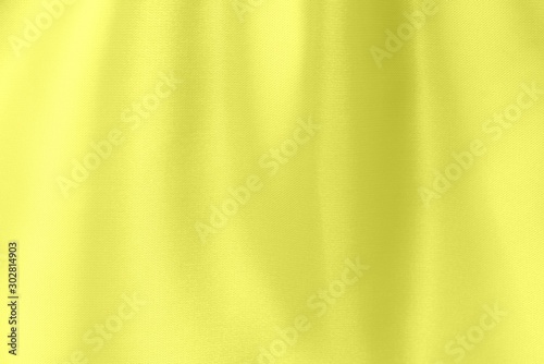 Yellow satin fabric texture soft blur background