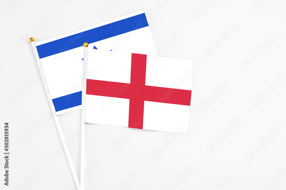 England and Israel stick flags on white background. High quality fabric, miniature national flag. Peaceful global concept.White floor for copy space.