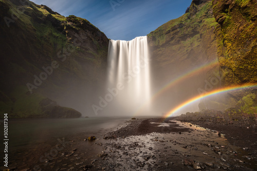 Skogafoss is a stunning waterfall in the South of Iceland measuring 200 feet tall and 80 feet wide. You can walk right up to it but it generates a huge amount of spray often causing double rainbows