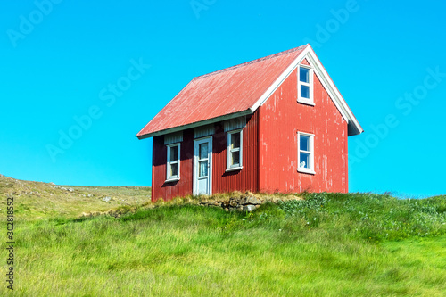 Red House, Green Grass, Blue Sky. 