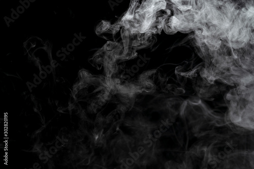 Abstract powder or smoke effect isolated on black background © sirawut
