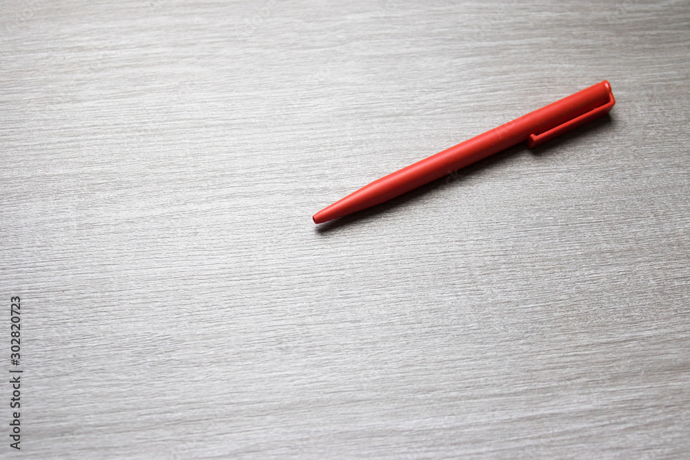 pen and eraser on wood table pen and eraser on wood table