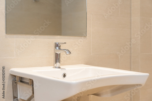 White sink with water faucet decoration in bathroom