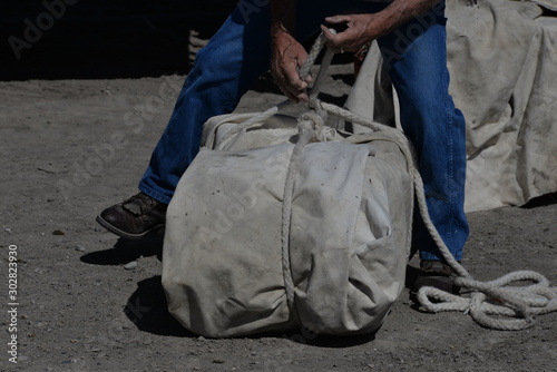 Outfitting a pack animal requires heavy rope and efficient knots. 