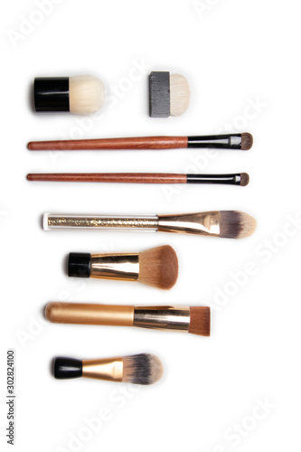 Different makeup brushes isolated on white background