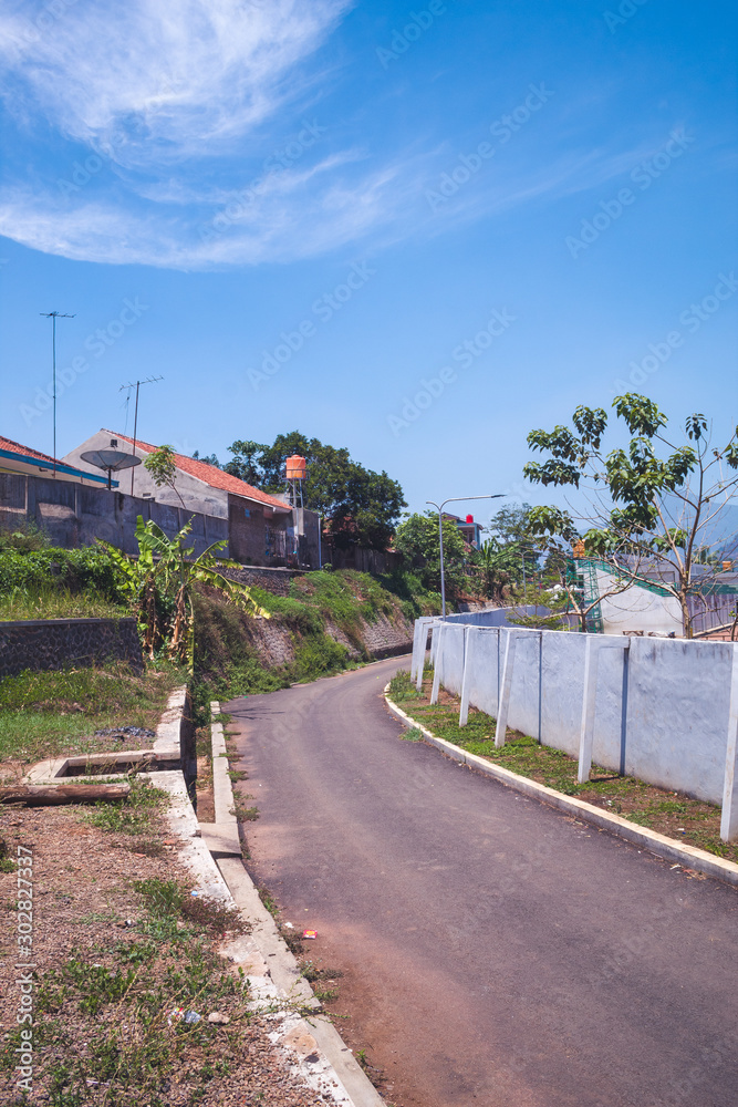 Asphalt road panorama in countryside in sunny summer day, with beautiful blue sky Asphalt road panorama in countryside in sunny summer day, with beautiful blue sky