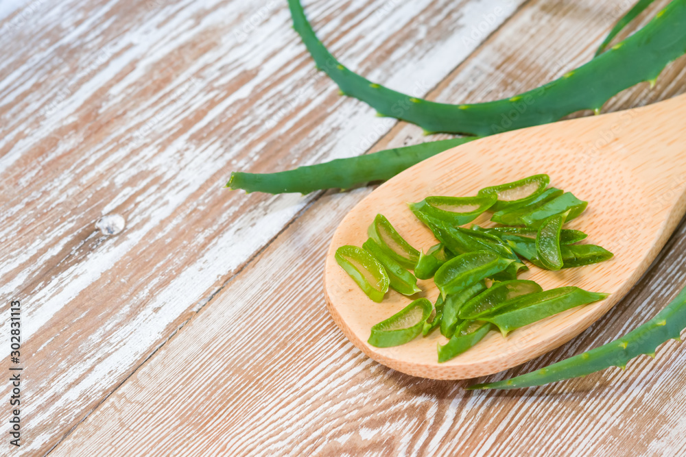 in a wooden spoon on a wooden background. The concept of health, treatment, herbal medicine, skin care,spa .Top view. Flat lay. in a wooden spoon on a wooden background. The concept of health, treatment, herbal medicine, skin care,spa .Top view. Flat lay.