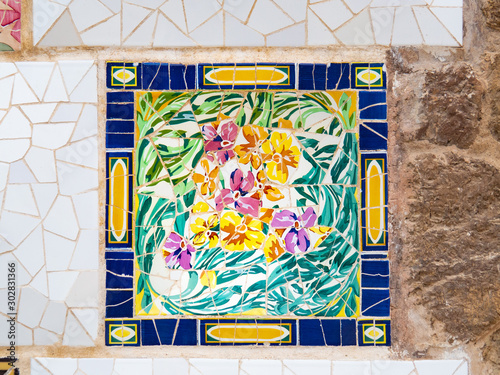 Photography Barcelona, Spain - august 2019: Multicolour abstract mosaic on the wall, close up view