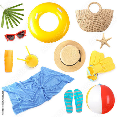 Set of beach accessories on white background photo