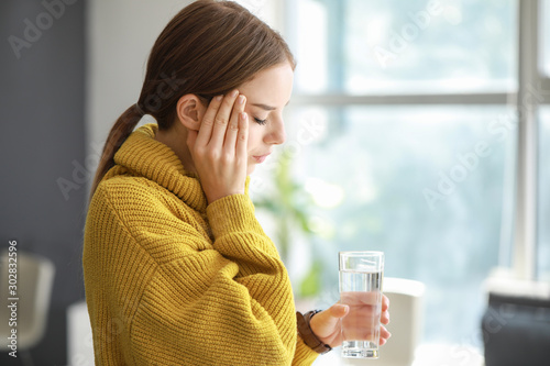 Young woman with glass of w...