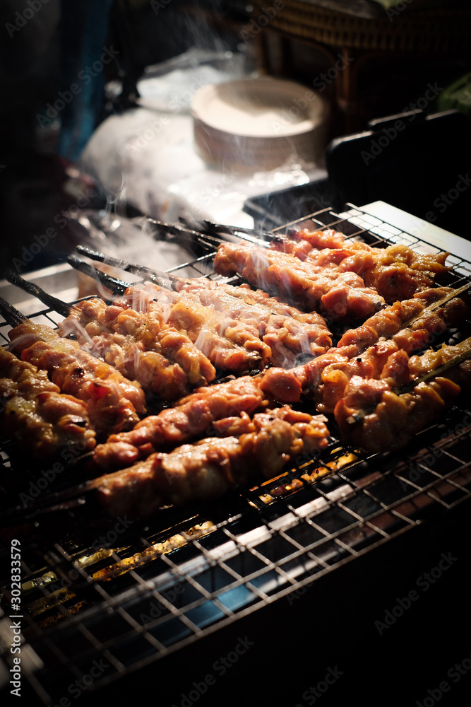 Chicken skewers were grilled on an electronic stove Chicken skewers were grilled on an electronic stove