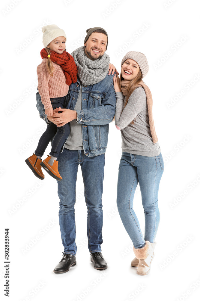 Portrait of happy family in autumn clothes on white background