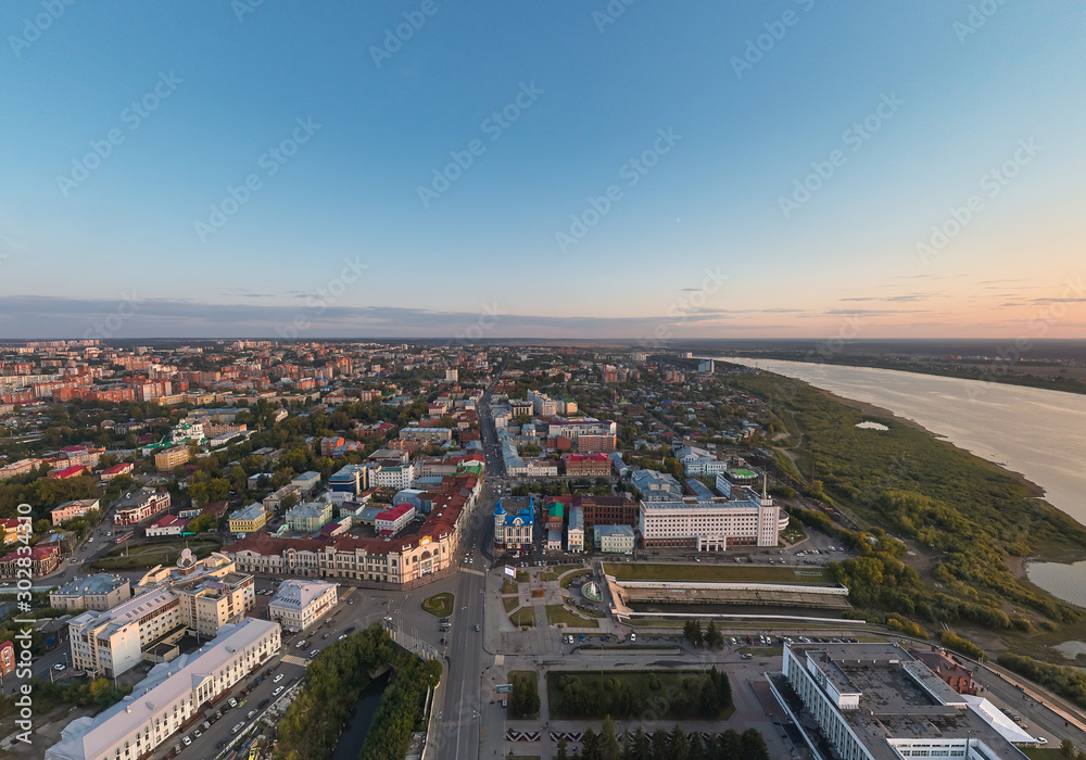 Aerial view of Tomsk city. Tom river, Ushaika river, Lenin Avenue. Russia. Summer, evening, sunset