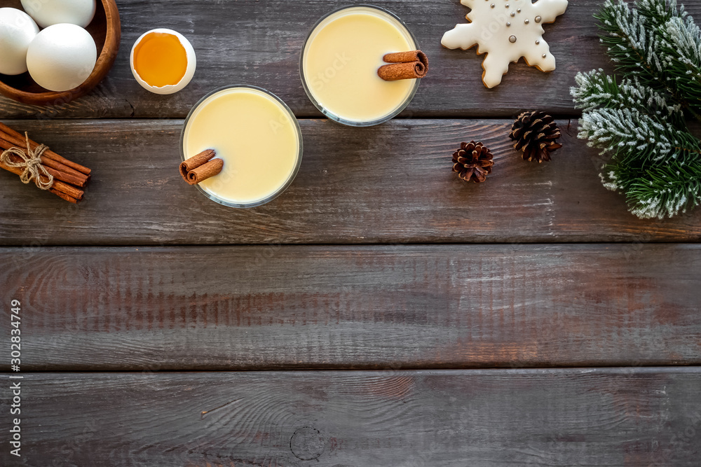 Make festive drink eggnog - ingredients on dark wooden background top view frame copy space Make festive drink eggnog - ingredients on dark wooden background top view frame copy space