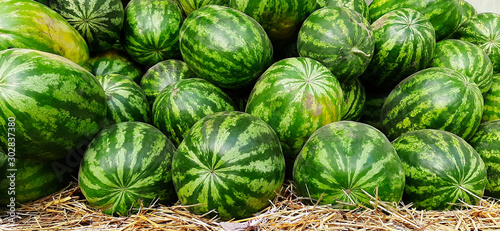 watermelons stacked on top of each other