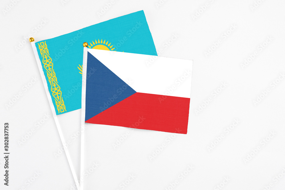 Czech Republic and Kazakhstan stick flags on white background. High quality fabric, miniature national flag. Peaceful global concept.White floor for copy space.