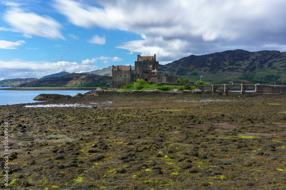 Eilean Donan Castle is one of the most visited and important attractions in the Scottish highlands , at the point where three great sea-lochs meet , Kyle of Lochalsh , Scotland Eilean Donan Castle is one of the most visited and important attractions in the Scottish highlands , at the point where three great sea-lochs meet , Kyle of Lochalsh , Scotland