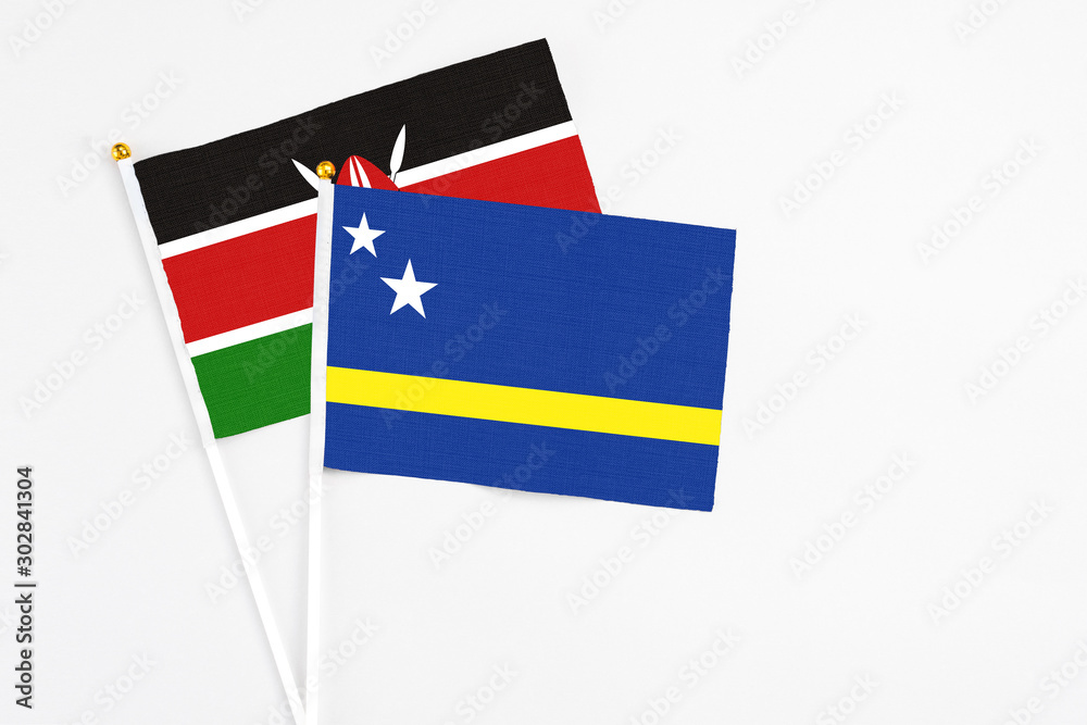 Curacao and Kenya stick flags on white background. High quality fabric, miniature national flag. Peaceful global concept.White floor for copy space. Curacao and Kenya stick flags on white background. High quality fabric, miniature national flag. Peaceful global concept.White floor for copy space.