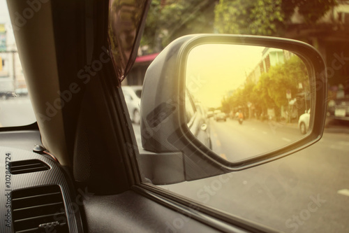 Car side mirror that reflects the back image to prevent road accidents.