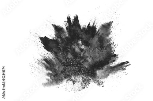 particles of charcoal on white background,abstract powder splatted on white background,Freeze motion of black powder exploding or throwing black powder.