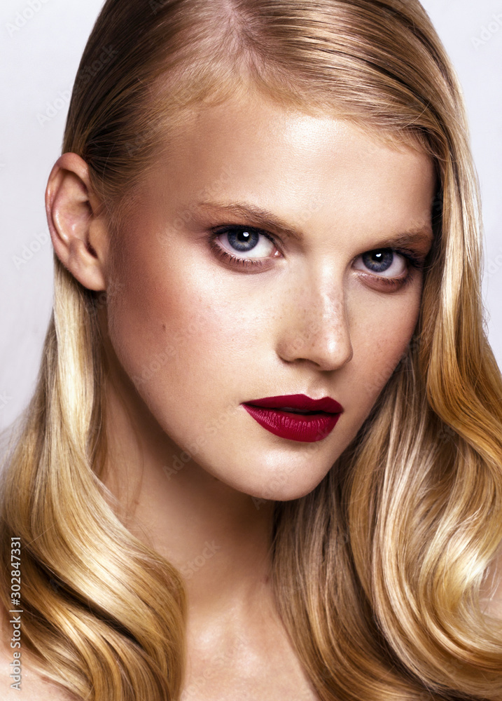 Close-up studio portrait of beautiful woman with bright make-up Close-up studio portrait of beautiful woman with bright make-up