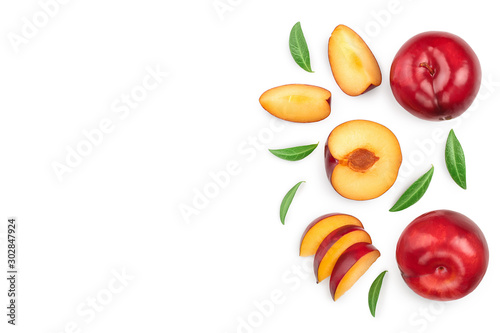 Fototapeta Naklejka Na Ścianę i Meble -  fresh red plum and half with leaves isolated on white background with copy space for your text. Top view. Flat lay