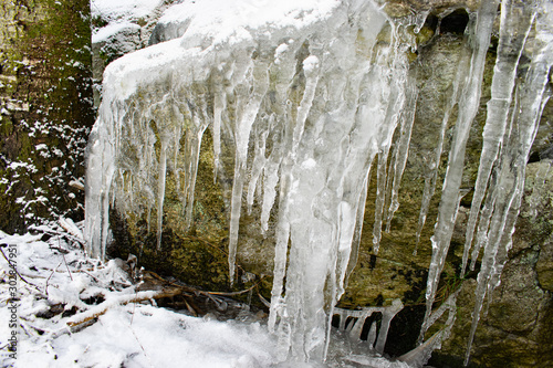 Frozen waterfall in forest