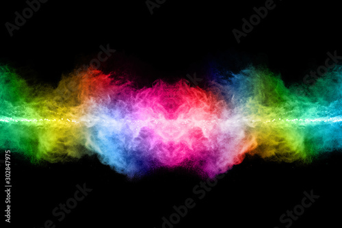 Fototapeta Naklejka Na Ścianę i Meble -  abstract colored dust explosion on a black background.abstract powder splatted background,Freeze motion of color powder exploding/throwing color powder, multicolored glitter texture.