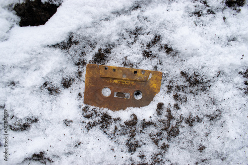 Frozen cassette tape in snow