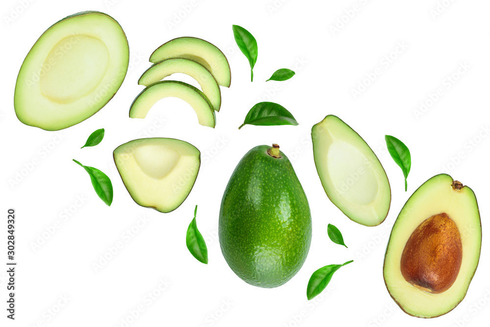 avocado and slices decorated with green leaves isolated on white background with copy space for your text. Top view. Flat lay avocado and slices decorated with green leaves isolated on white background with copy space for your text. Top view. Flat lay