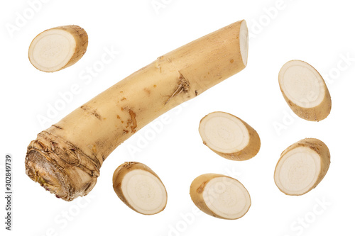 Horseradish root with slices isolated on white background. Top view. Flat lay