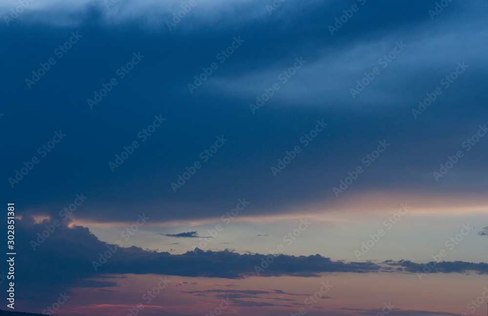 Landscape with beautiful sky at sunset and dark clouds