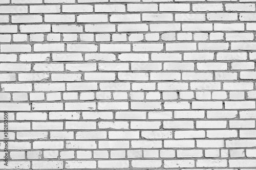 Black and white background with white silicate brick structure of brick wall with cement construction joints