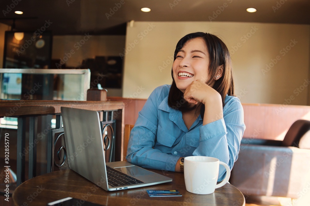 woman sitting at table in cafe woman sitting at table in cafe