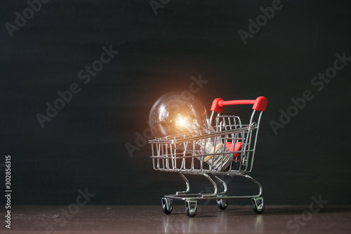 Shopping cart with light bulb.