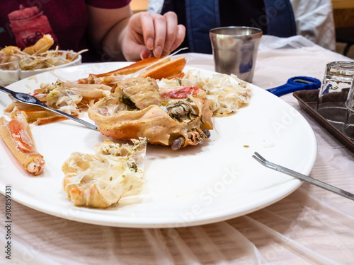 eating of cooked crab in local eatery in Sokcho photo