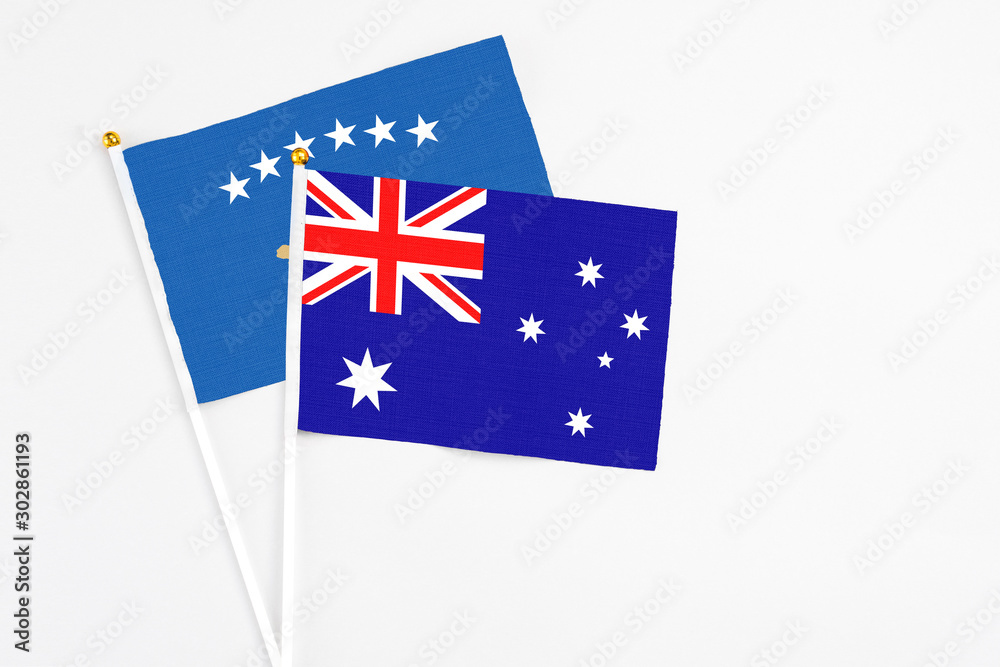 Fototapeta premium Australia and Kosovo stick flags on white background. High quality fabric, miniature national flag. Peaceful global concept.White floor for copy space.