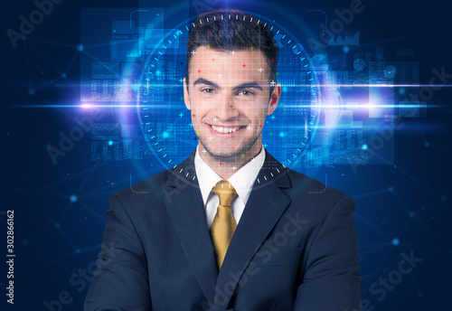 Facial recognition system. Young man on blue background
