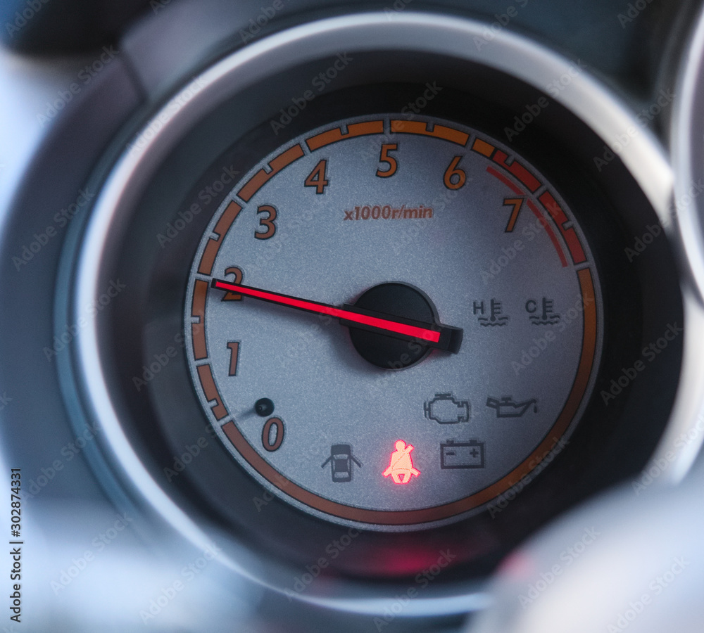 Car tachometer, dashboard, arrow indicates 2,000 rpm