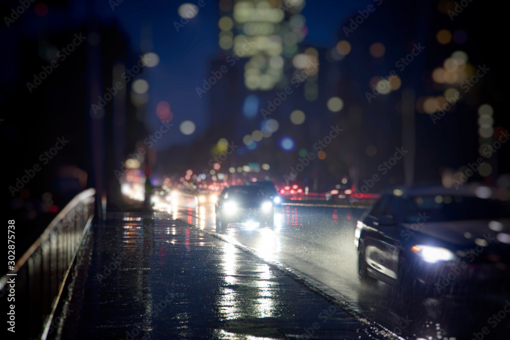 traffic in the city on rainy night