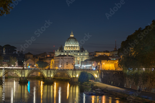 Dusk at the Vatican City. St. Peter's basilica in Rome, Vatican, the dome at sunset with reflection. Night view at St. Peter's cathedral in Rome, Italy. Scenic background. Popular travel destination.