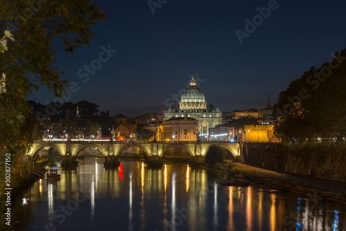Dusk at the Vatican City. St. Peter's basilica in Rome, Vatican, the dome at sunset with reflection. Night view at St. Peter's cathedral in Rome, Italy. Scenic background. Popular travel destination.