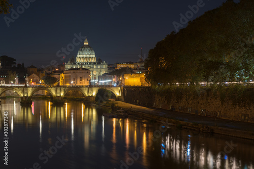 Dusk at the Vatican City. St. Peter s basilica in Rome  Vatican  the dome at sunset with reflection. Night view at St. Peter s cathedral in Rome  Italy. Scenic background. Popular travel destination.