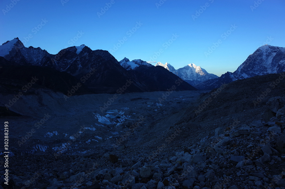 Everest base camp trek along Khumbu glacier, First sun is touching Himalayas mountains, Sagarmatha national park, Solukhumbu, Nepal
