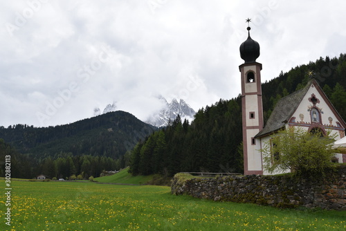 Church of St. Magdalena in Funes valley in italian Dolomites in spring