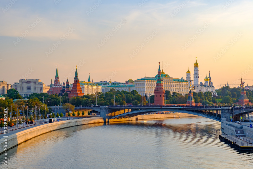 Morning city landscape with view on Moscow Kremlin and river embankment.