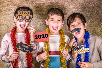 Three kids celebrating New Years Eve. 2020!