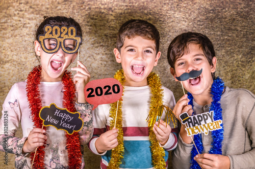 Three kids celebrating New Years Eve. 2020!